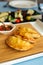 Spanish empanadas with sauce on restaurant table