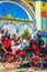 Spanish families in traditional and colorful dress travelling in a horse drawn carriages at the April Fair