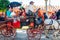 Spanish families in traditional dress travelling in a horse drawn carriages at the April Fair, Seville Fair