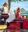 Spanish families in traditional dress travelling in a horse drawn carriages at the April Fair, Seville Fair Feria de Sevilla