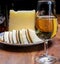 Spanish fino sherry wine from Andalusia and pieces of different sheep hard manchego cheeses made in La Mancha, Spain. Wine and