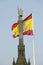 Spanish flag waves behind statue of Christopher Columbus, Plaza de Colï¿½n in Madrid, Spain