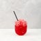 Spanish Granizado or Slushie - drink with natural juice. Fruit shaved ice in clear glass. Refreshing summer drink