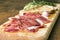 Spanish ham with toasts as background