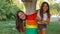 Spanish lesbian couple posing with a pride flag