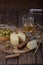 Spanish Manchego cheese with white wine, nuts and olives on wooden background