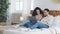 Spanish married couple Arab ethnic handsome bearded boyfriend and curly girlfriend husband and wife lie together on bed