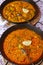 spanish paella close up photo in frying pan with shrimps, peas and lemon slice