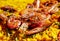 Spanish paella with green beans, large prawns and other seafood