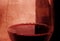 Spanish red wine Glass with bubbles and bottle on grunge arty background