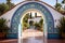 spanish revival tiling on an arched gateway