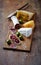 Spanish Salami, Brie and Hard Cheese on a Wooden Board