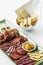 Spanish serrano ham chorizo sausage and cheese tapas platter