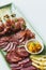 Spanish serrano ham chorizo sausage and cheese tapas platter