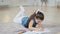 Spanish spaniard caucasian little small school girl daughter child pupil kid lying on floor draws picture drawing on