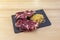 Spanish tapa of Tosta de tasty Iberico ham with straw potatoes