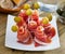 Spanish tasty meal rolls of iberian jamon served with olives at plate
