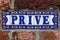 Spanish tile sign with the Dutch word Prive which means: Private