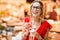 Spanish woman eating jamon at the market