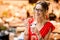 Spanish woman eating jamon at the market