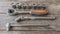 Spanner head and power wrench on a wooden table in the workshop