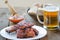 Spareribs on grill with hot marinade, czech beer