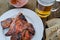 Spareribs on grill with hot marinade, czech beer