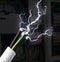 Sparking cables against blurred electric cabinet