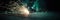 sparking sparkler in the green area. sparkler fire with blurred bokeh background. new year or St. Patrick\\\'s Day. banner