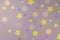 Sparkle glitter confetti woth dots and stars on pastel lilac background. Shiny girly backdrop for your design. Festive