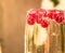 Sparkle wine in glass with red currant berries