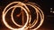 sparkler on black background _A fire hoop spinning in the darkness, creating a mesmerizing pattern of flames and smoke