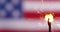 Sparkler burning in front of American flag