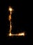 Sparkler firework light alphabet L (Capital Letters) at night