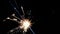 Sparkler fireworks burning on a black background, congratulations, greetings, party, happy new year