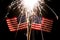 Sparkler over two American Flags for 4th of July celebration