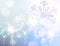 Sparkler with snowflake sign on blue glitter christmas background