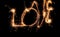 Sparklers forming word LOVE on dark background