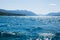 Sparkling blue water and blue mountains Lake McDonald. Glacier N