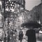 A SPARKLING CHRISTMAS LIGHT DISPLAY ON A RAINY STREET