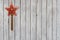 Sparkling Christmas Star Velvet Ornament on Weathered Wooden Background