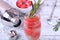 Sparkling cocktail with watermelon balls and rosemary in a champagne glass