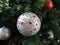 Sparkling crystal beaded silver ball hanging on Christmas tree