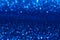 Sparkling deep blue glitter texture background