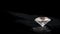 sparkling diamond on dark rock