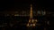 Sparkling Eiffel tower in Paris seen at night from an aerial view