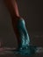 Sparkling glittering body art on female leg, close up of woman's sole feet in blue brilliance glitter, podiatry concept