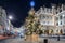 A sparkling, lit christmas tree in the center of London, United Kingdom