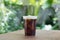 Sparkling Nitro Cold Brew Coffee in take away cup.