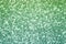 Sparkling pink, menthol, emerald sequin textile background. Fashion fabric glitter, sequins